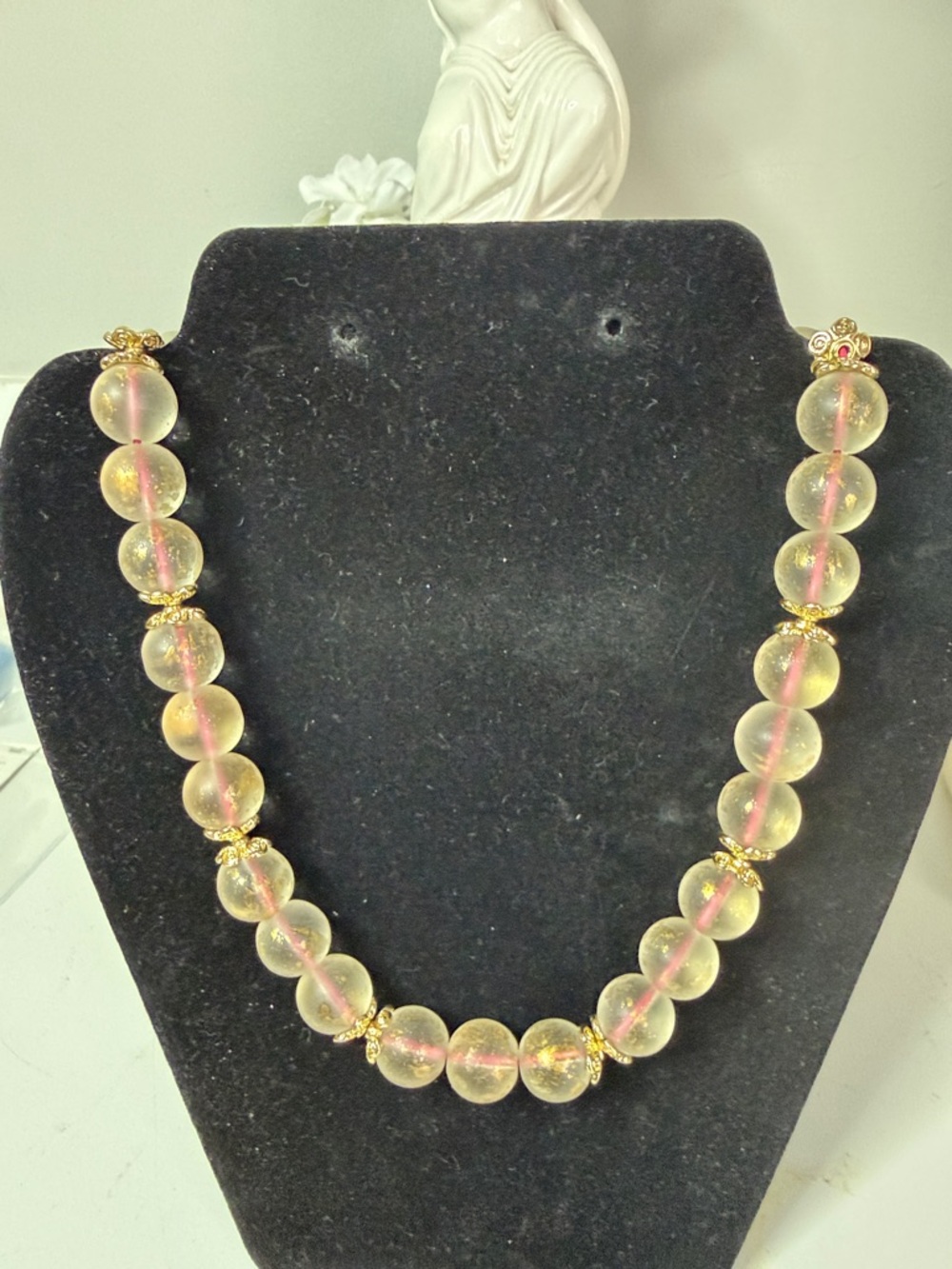 Gold-Tone Citrine Iridescent Bead Necklace. Beads are strung with pink cording.